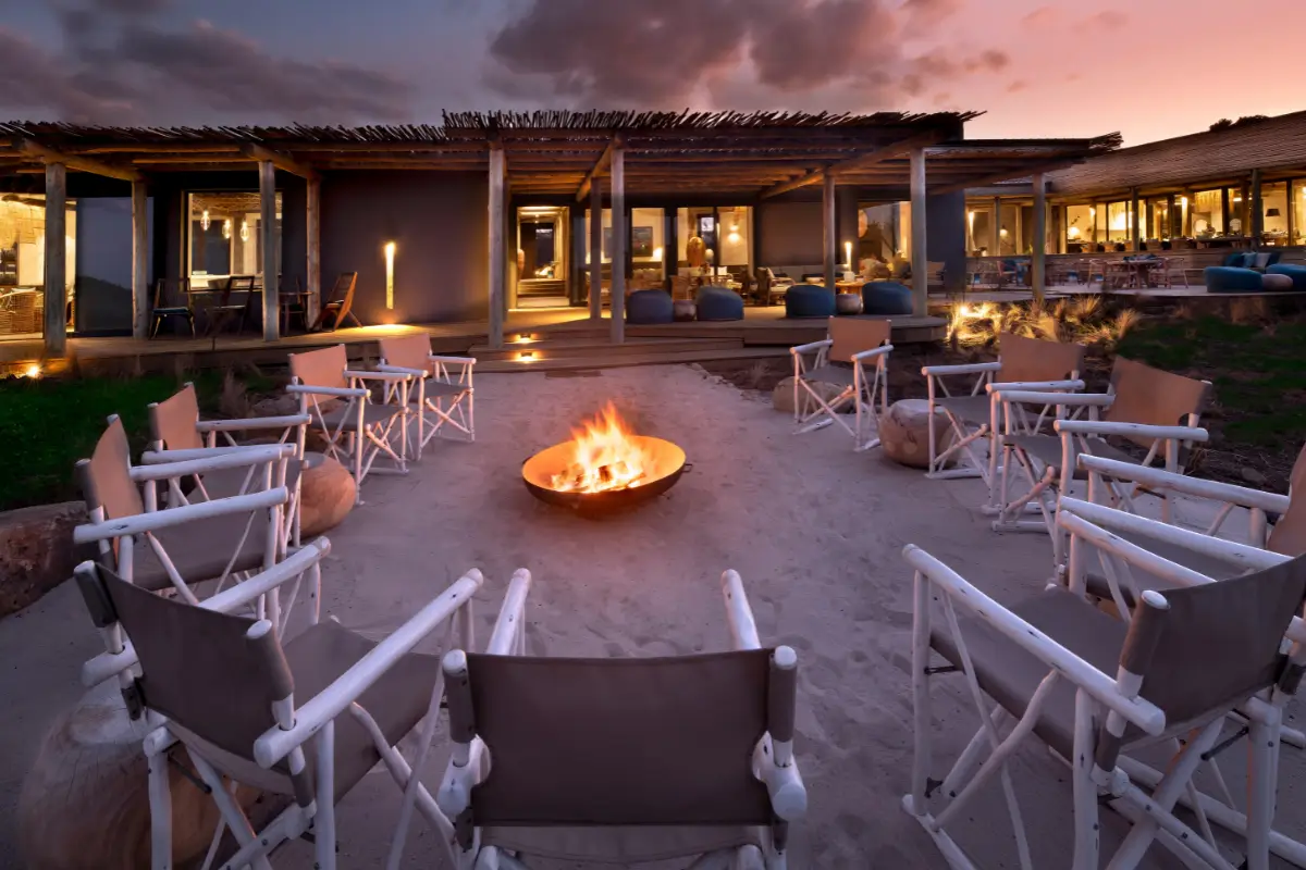 Evening fire pit and seating area at Gwegwe Beach Lodge on the Wild Coast, Mkambathi Nature Reserve, at sunset