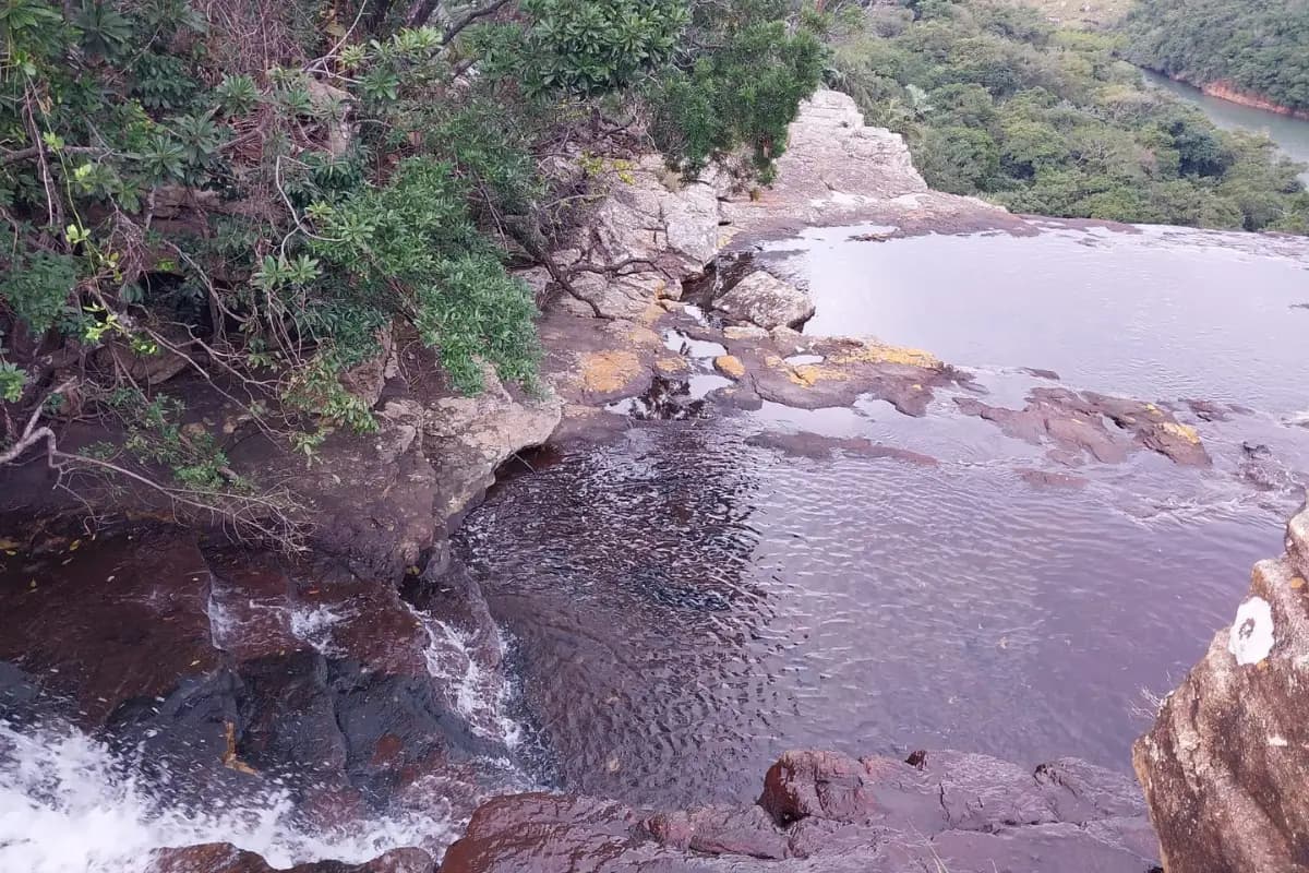 Rocky natural pool and small waterfall viewed from above on the Wild Coast, South Africa