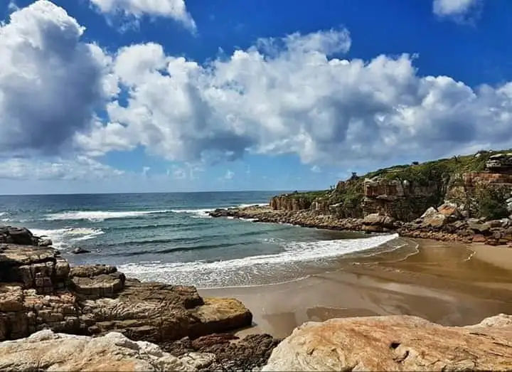 Rocky cove at Mkambati with dramatic clouds
