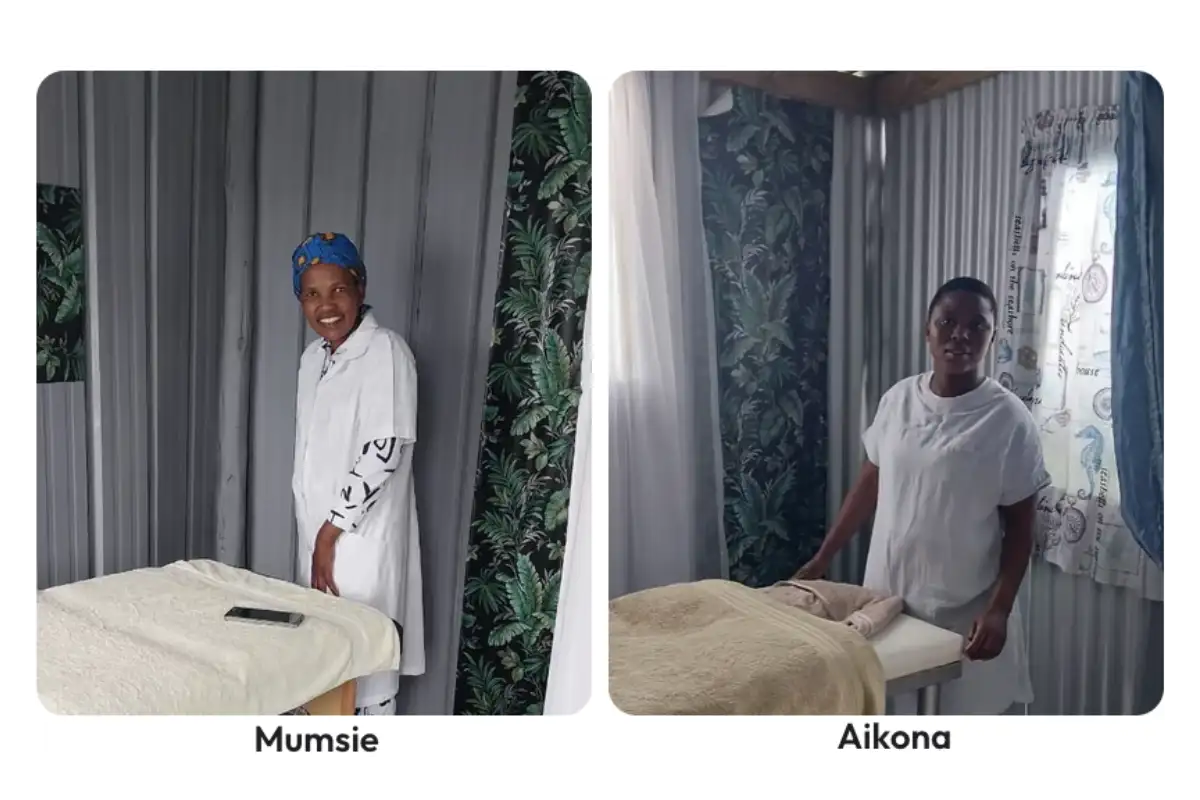 Mumsie and Aikona, massage therapists in white uniforms, beside treatment tables at Pamper Shack near Mtentu River