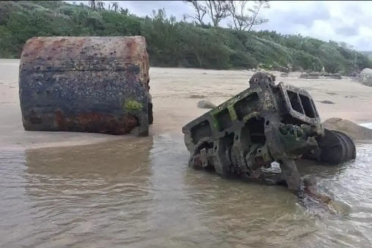 Rusted wrecked vehicle and barrel half-submerged in the Sikombe estuary on the Wild Coast South Africa