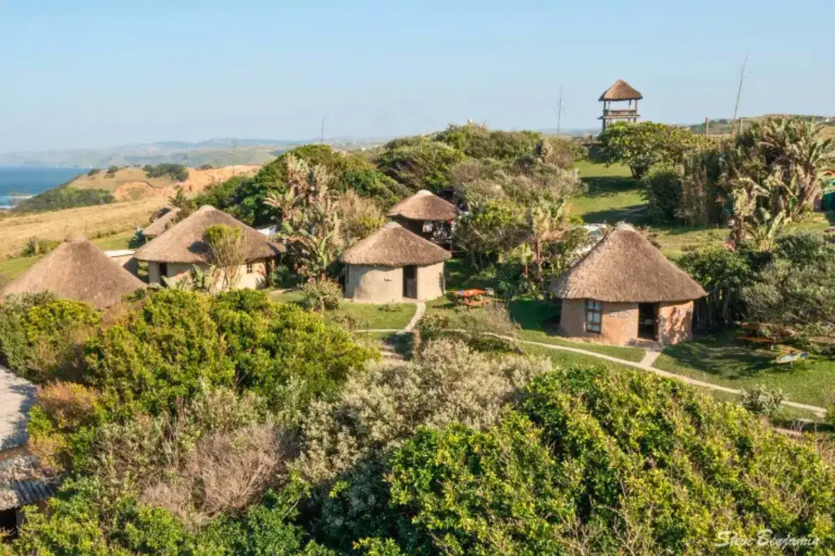 Thatched rondavel lodge accommodation at Mdumbi overlooking the Wild Coast ocean